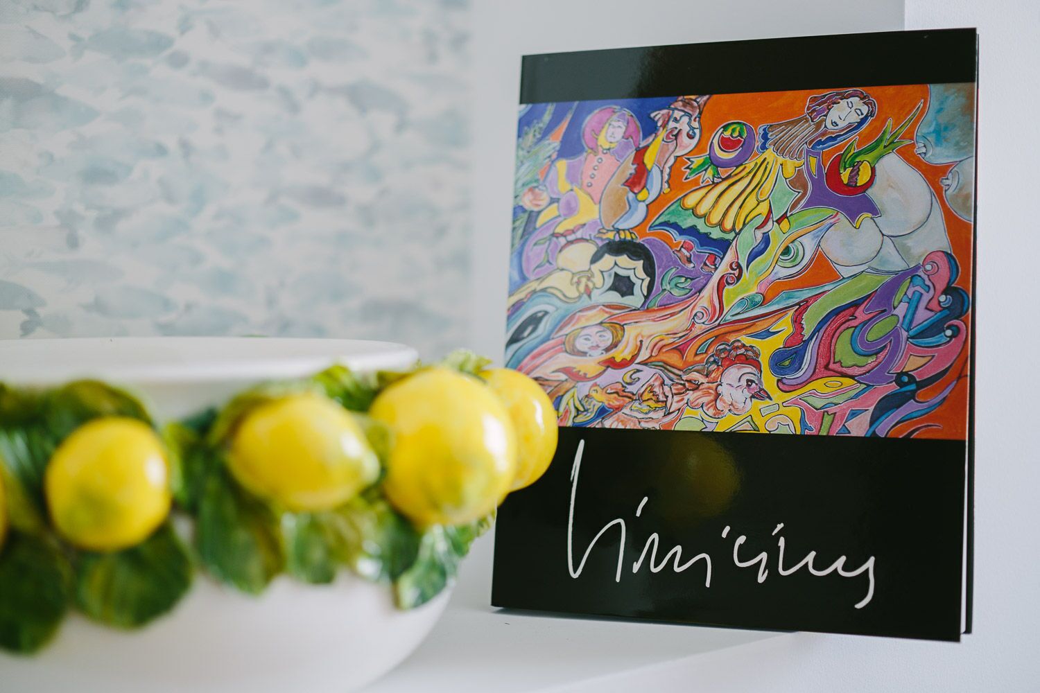 A colorful artwork with the signature "Mimi's" on a black background.