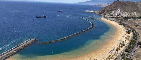 On the beach, sun-loungers, beach towels