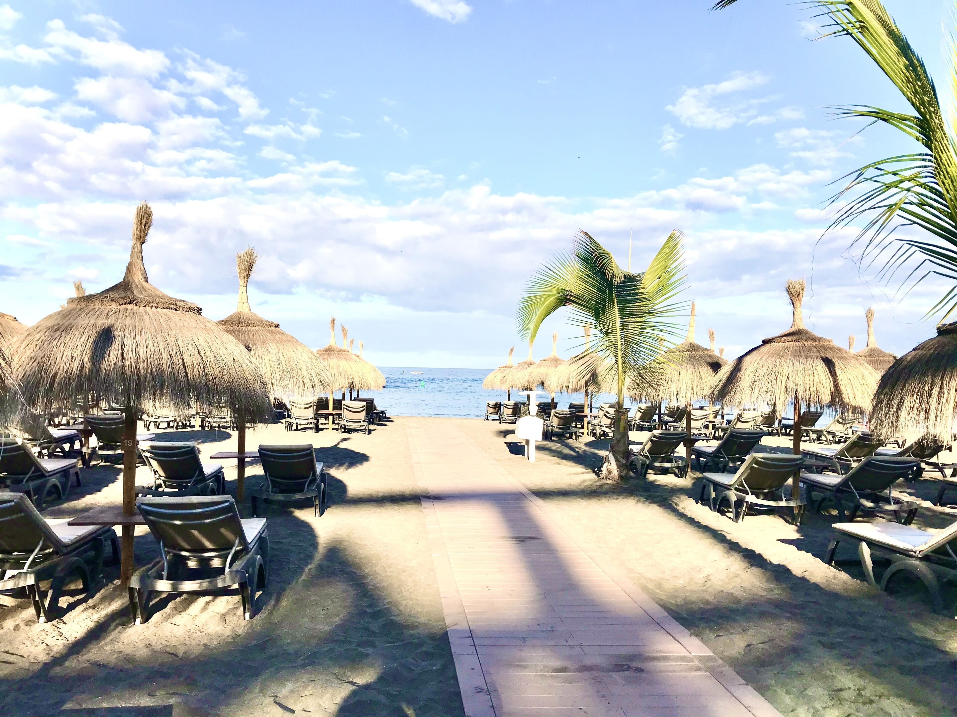 On the beach, sun loungers, beach towels