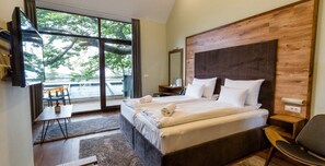 Superior Triple Room | Minibar, in-room safe, desk, blackout curtains