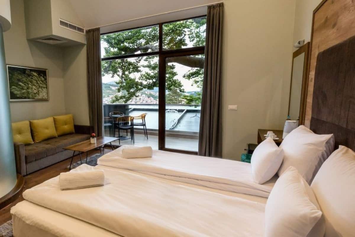 Superior Triple Room | Minibar, in-room safe, desk, blackout drapes