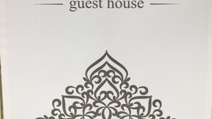 A sign with the word "PARADISE" and "guest house" indicating a type of accommodation. - Hostel Paradise inn (Tashkent)