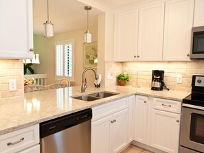 Enjoy convenient cooking and cleaning with an oven and dishwasher.