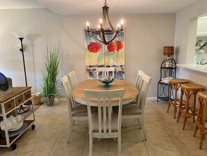 Enjoy meals in this cozy dining area with a round table and comfortable seating for four.