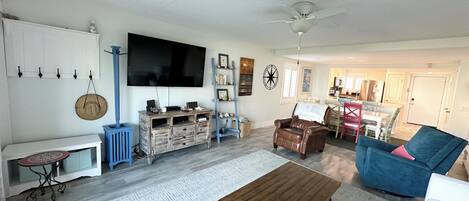 Flat-screen TV, DVD player, books