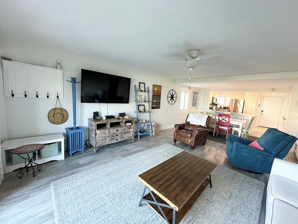Flat-screen TV, DVD player, books