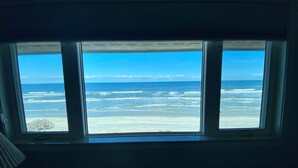 A window with a view of the beach and ocean. - Don't miss this direct Oceanfront view at the beloved Summerhouse 254 (St. Augustine)