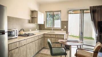 Modern Studio Apartment Private Garden With Pool | Private kitchen | Full-sized fridge, stovetop, coffee/tea maker, blender