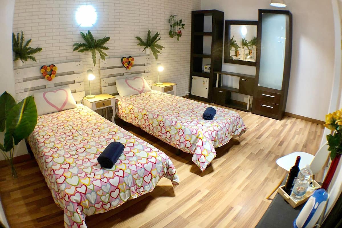 Economy Double Room, Private Bathroom | 1 bedroom, in-room safe, blackout curtains, iron/ironing board