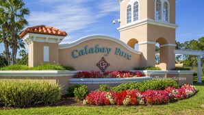 A building with a sign reading "Calabay Parc" and a decorative emblem.