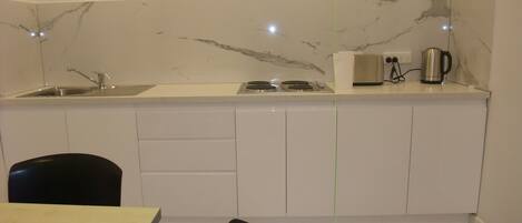 Fridge, microwave, electric kettle, toaster