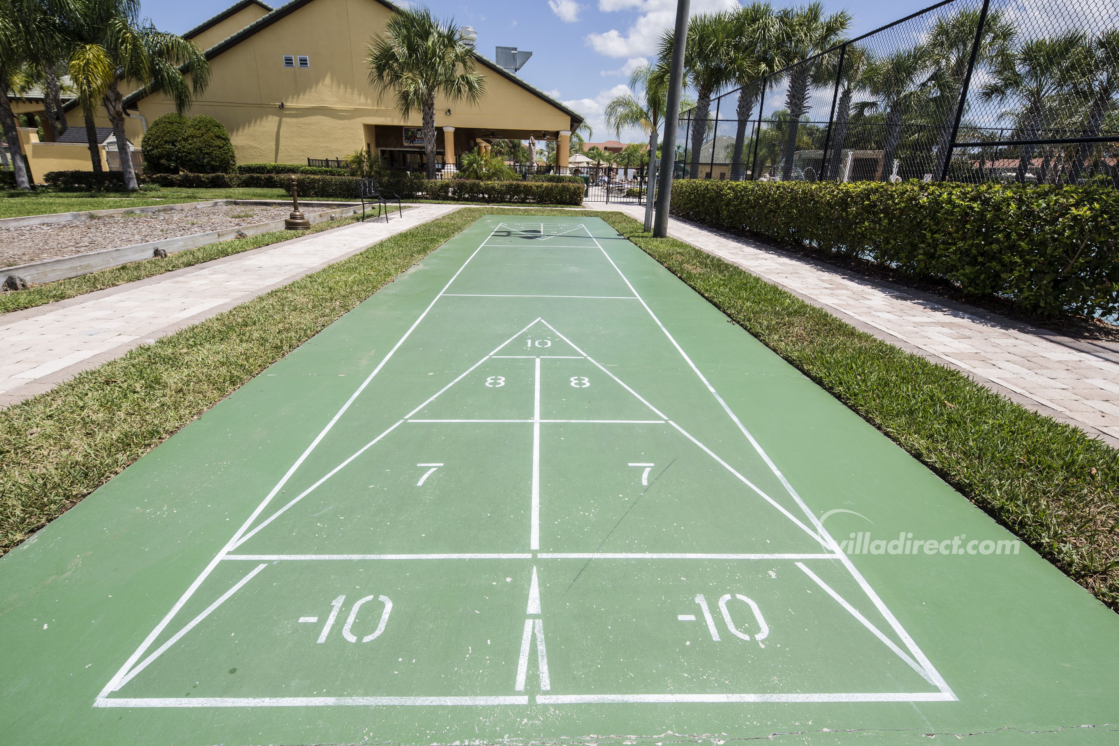 A shuffleboard court with numbers 7, 8, 9, 10, -10, and -10.