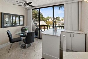 Dining - Waterfront 3BR/2BA condo with pool, marina access, WiFi, and heated pool. (Marco Island)