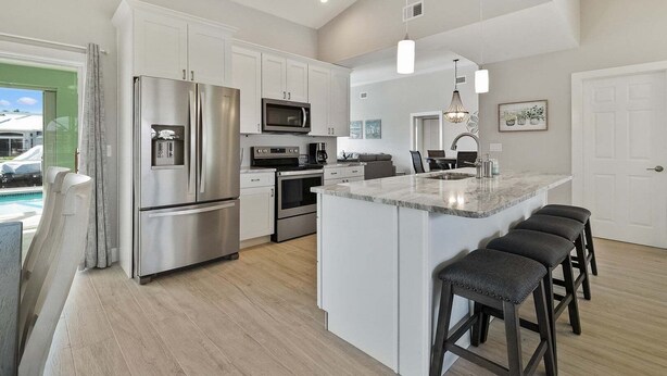 Unclassified image, 1 of 23, button - Waterfront 3BR Marco Island home with heated pool and Wi-Fi. (Marco Island)