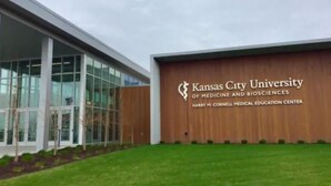 A building with a sign that reads "Kansas City University of Medicine and Biosciences". - NEW Sleek, Contemporary Home Near Med School (Joplin)