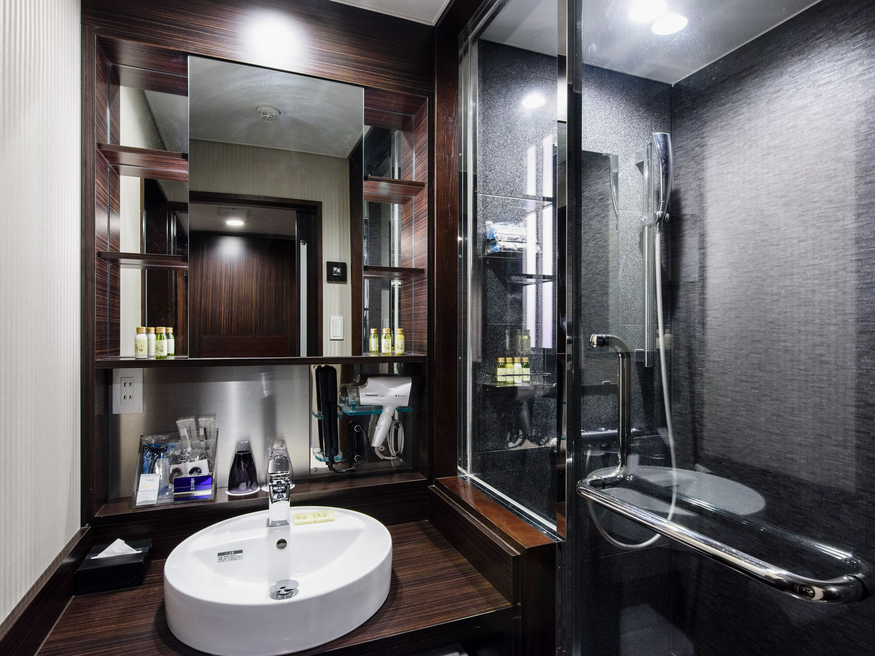 hair dryer, slippers, electronic bidet, towels