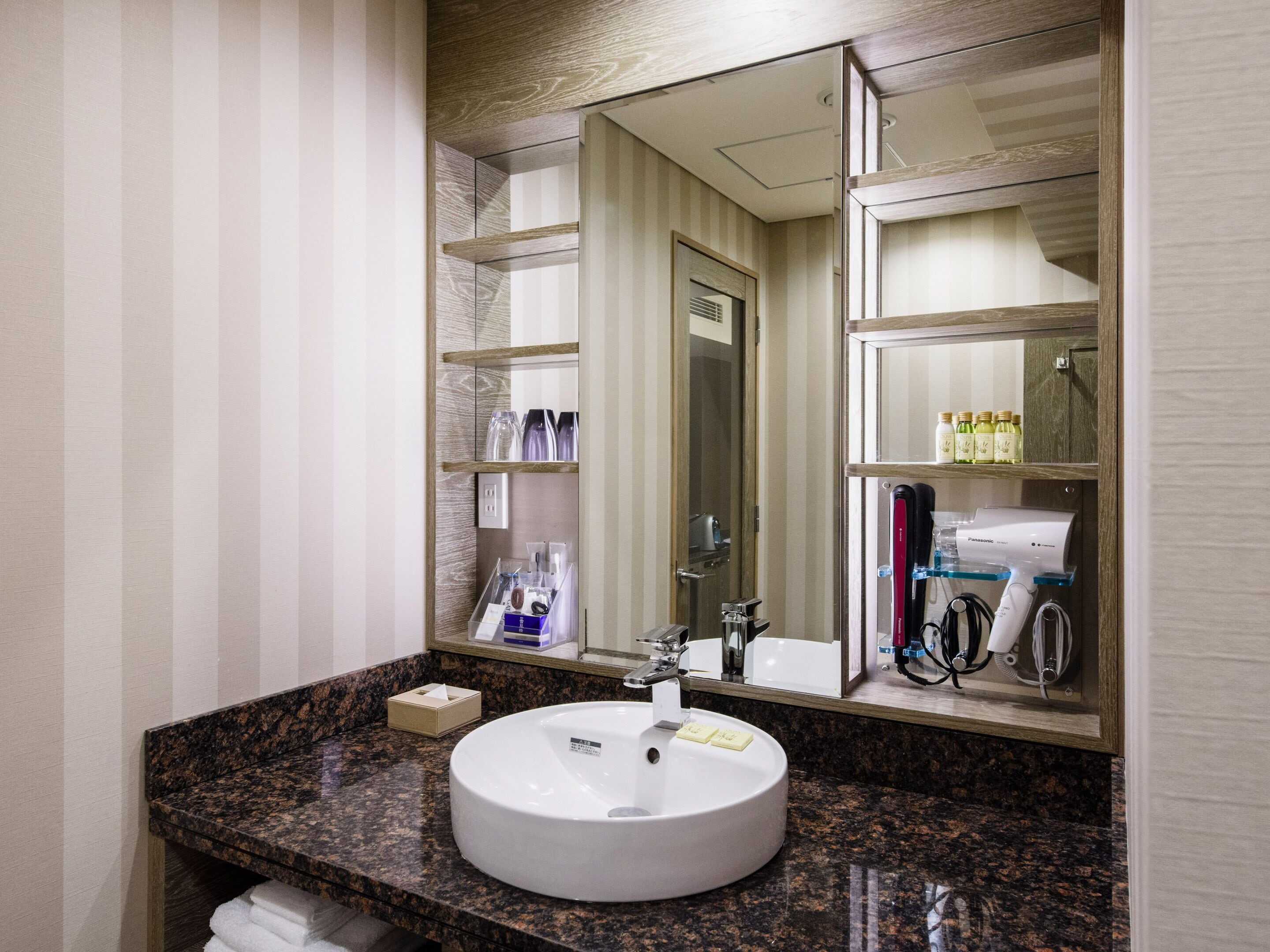 hair dryer, slippers, electronic bidet, towels