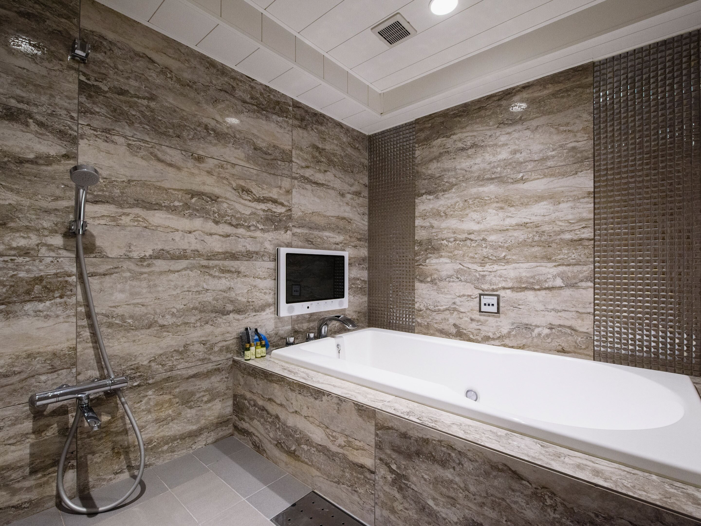 hair dryer, slippers, electronic bidet, towels