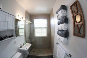 Shower, hair dryer, towels, soap