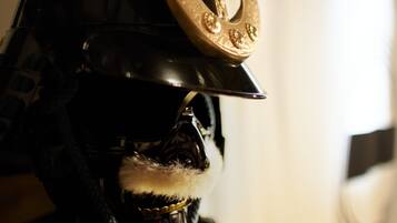A close-up of a helmet with a decorative emblem and a sword.