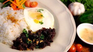 A plate with white rice, a fried egg, and a dark meat dish, accompanied by vegetables and a small bowl of sauce. - Balconahe Resto Camp (Antipolo)