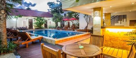 Outdoor pool, open 7:00 AM to 10:00 PM, pool umbrellas, pool loungers