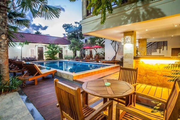 Outdoor pool, open 7:00 AM to 10:00 PM, pool umbrellas, pool loungers