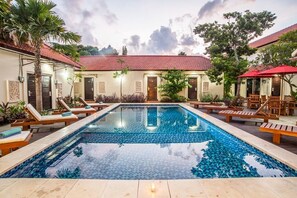 Outdoor pool, open 7:00 AM to 10:00 PM, pool umbrellas, pool loungers
