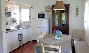Fridge, microwave, high chair, dining tables