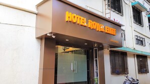 A hotel entrance with a sign reading "HOTEL ROYAL". - Hexa Royal Elite (Mumbai)