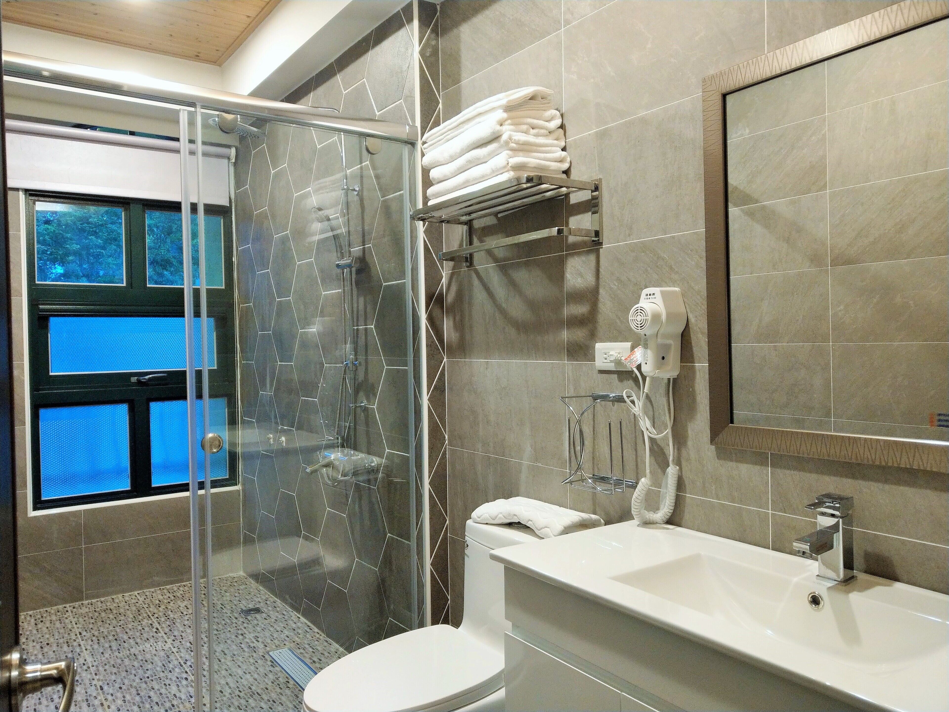 elite house | bathroom | shower, rainfall showerhead, hair dryer, slippers