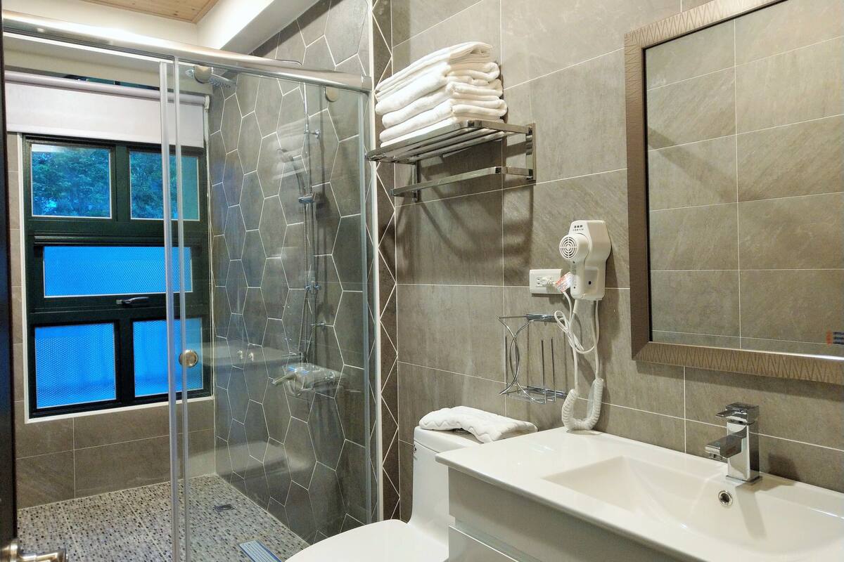 elite house | bathroom | shower, rainfall showerhead, hair dryer, slippers