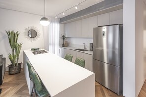 Design Apartment | Private kitchen | Full-size fridge, microwave, oven, stovetop