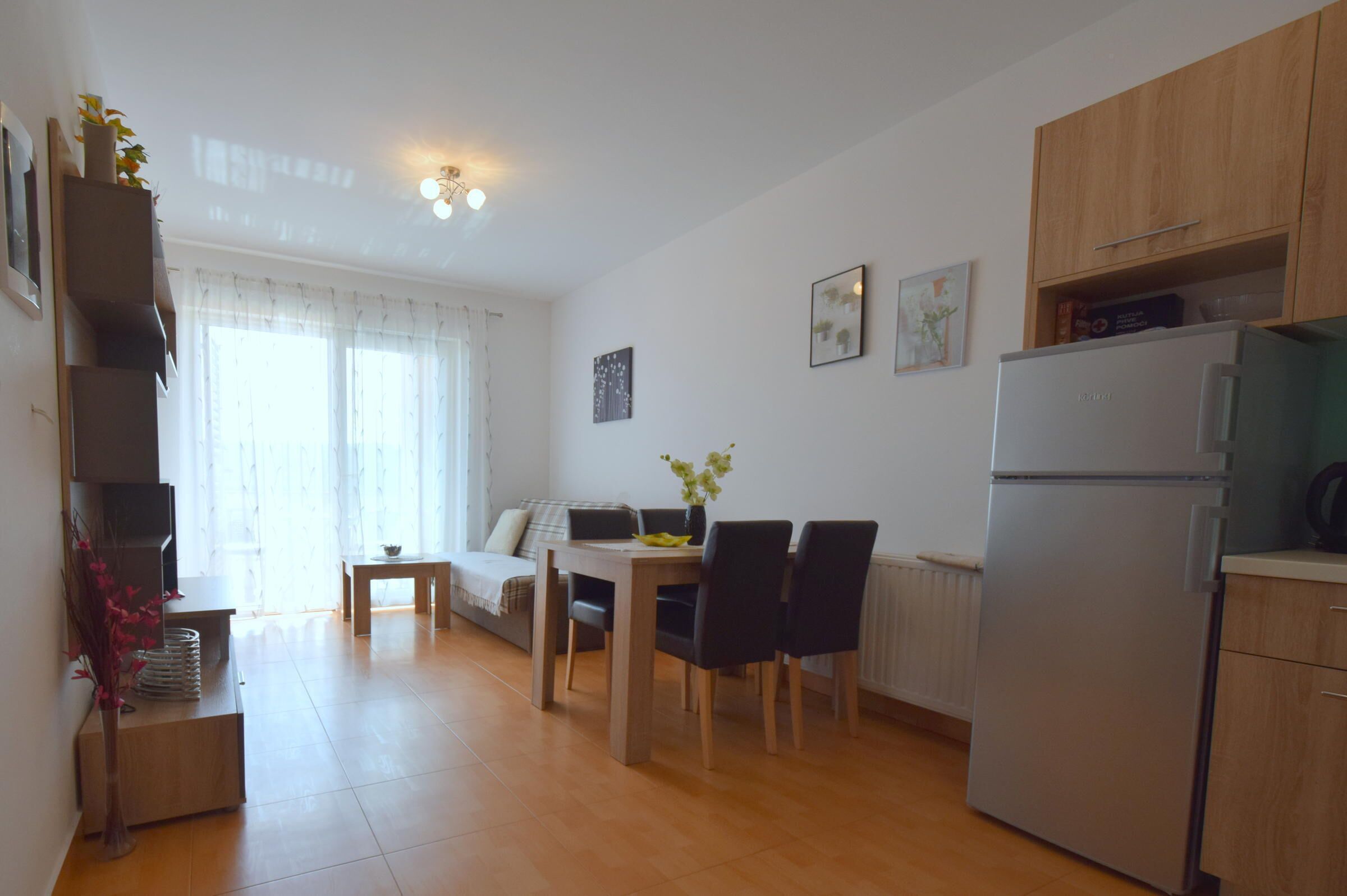 Apartment, Sea View | Living room | Flat-screen TV