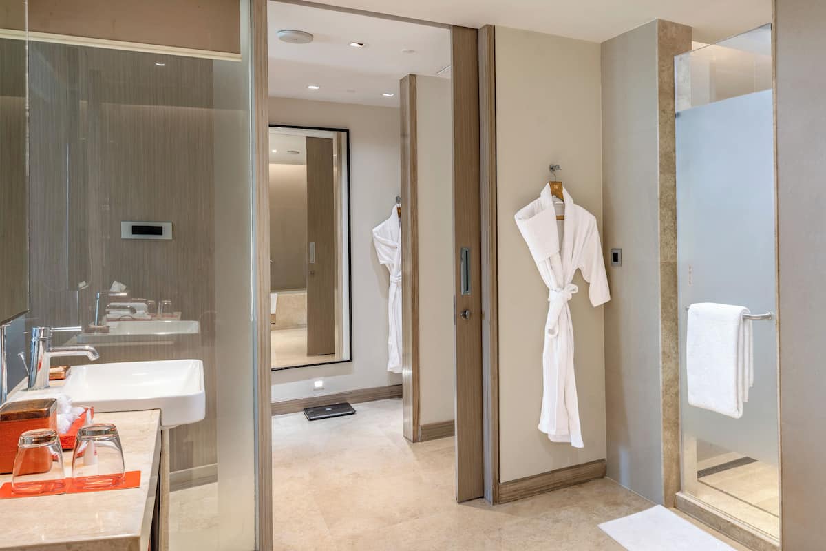 suite, 1 king bed (junior suite) | bathroom | rainfall showerhead, designer toiletries, hair dryer, bathrobes