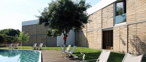 2 outdoor pools, open 10:00 AM to 8:00 PM, pool umbrellas, pool loungers