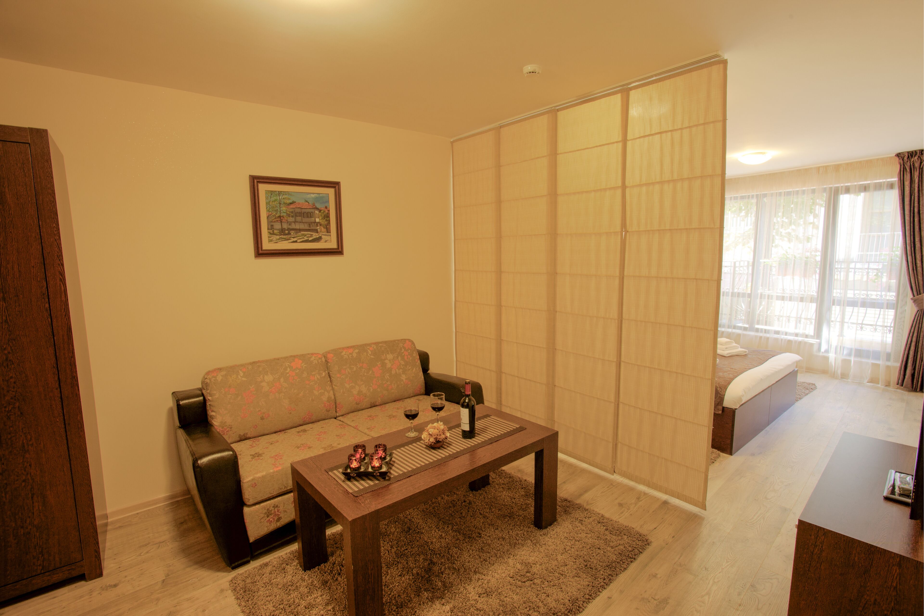 deluxe double room | living room | flat-screen tv