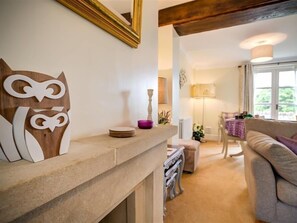 Relax in a stylish living area with a sofa, chair, and dining table, perfect for socializing or enjoying meals.