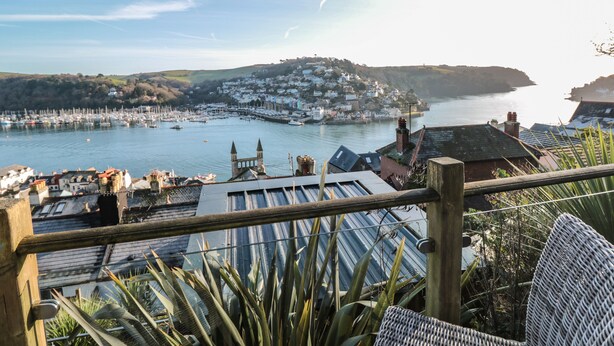 A coastal town with a marina, houses on a hillside, and a view of the sea. - Harbour Heights (Dartmouth)
