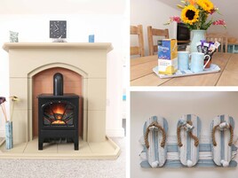 Una chimenea con un reloj encima, una mesa de comedor con un jarrón de flores y una pared decorada con motivos náuticos.