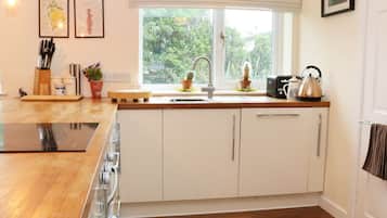 Cottage | Private kitchen | Microwave, stovetop, dishwasher, highchair