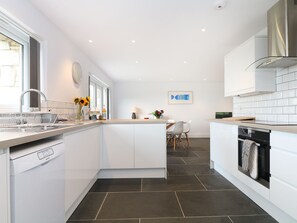 Cottage | Private kitchen | Stovetop, dishwasher, high chair, cookware/dishes/utensils
