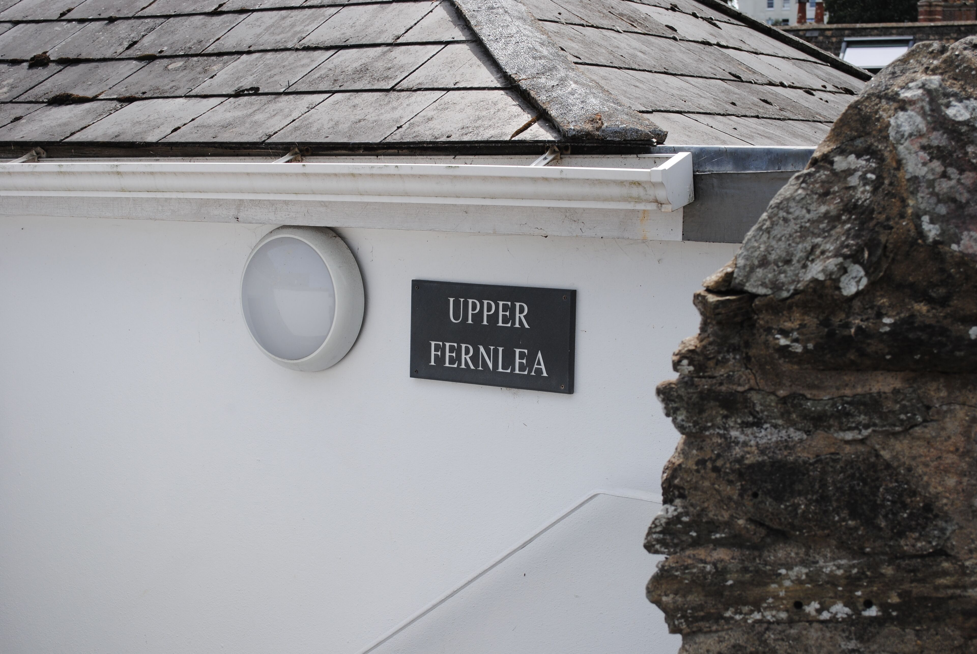 A building with a sign reading "UPPER FERNLEA".