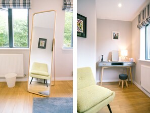 A room with a large window, a chair, a desk, and a radiator. - Sidings at Brunel Two (Lostwithiel)