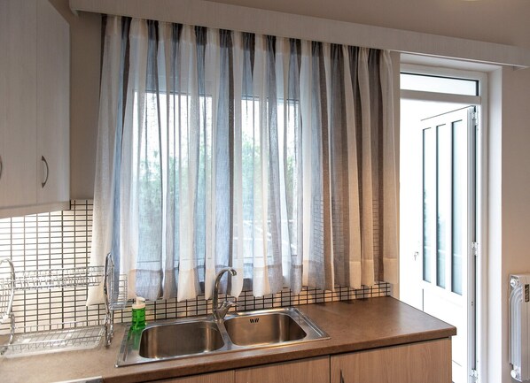 Apartamento | Cozinha privada | Geladeira, fogão, cooktop, cafeteira/chaleira