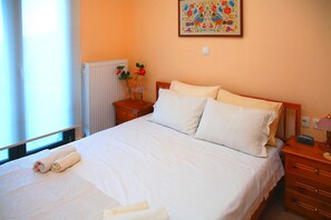 Appartement, 1 slaapkamer | 1 slaapkamer, een strijkplank/strijkijzer, gratis babybedden, beddengoed