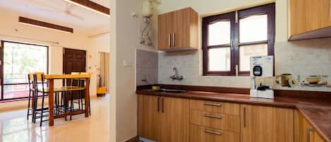 Fridge, stovetop, cookware/dishes/utensils, dining tables