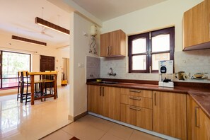 Fridge, stovetop, cookware/dishes/utensils, dining tables - Serene 2 bed Apartment on City-side HillTop (Vigyan Vihar Colony)