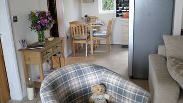 House, 1 Bedroom | Living area | Flat-screen TV, DVD player