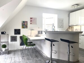 Fridge, stovetop, dishwasher, coffee/tea maker
